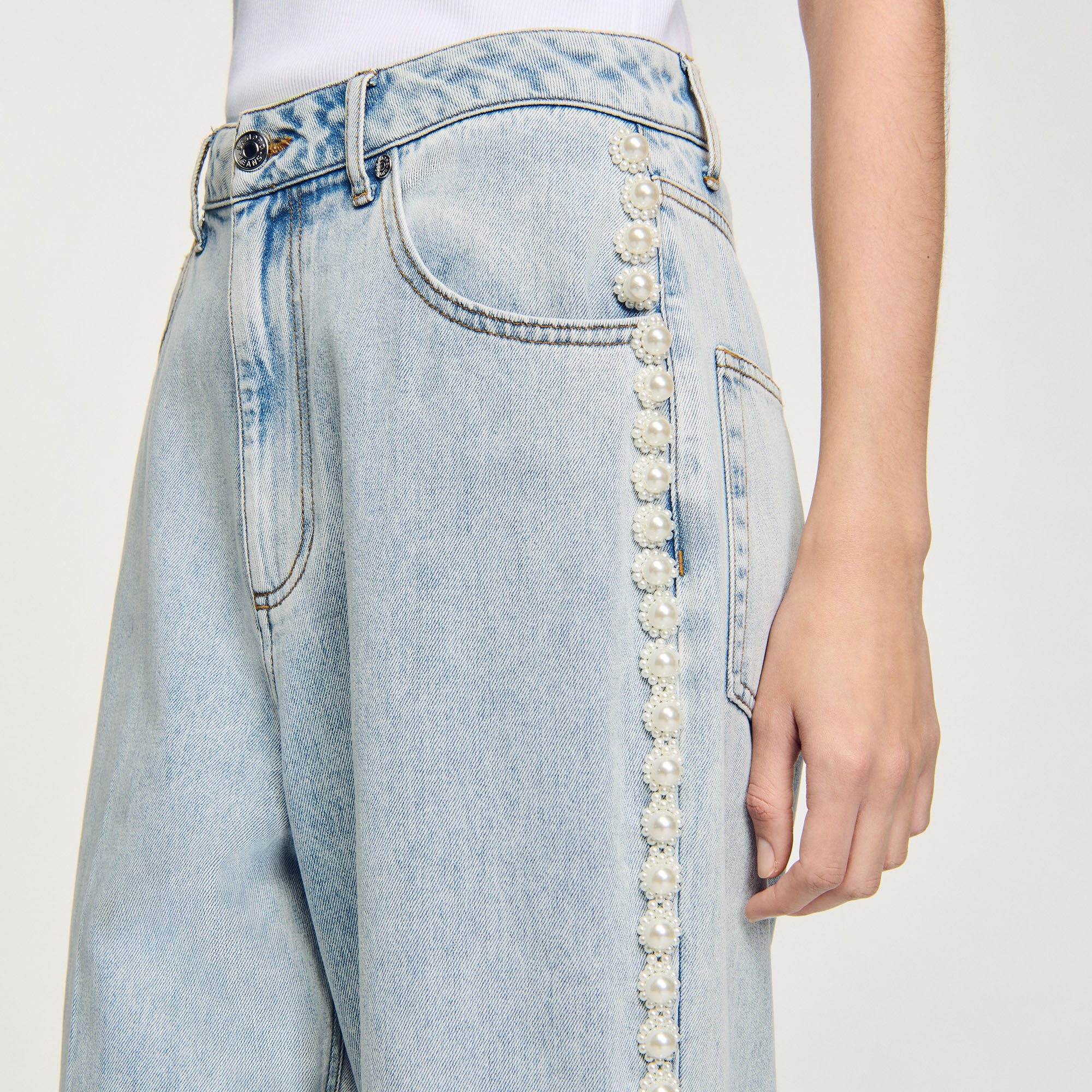 Jeans met kralen