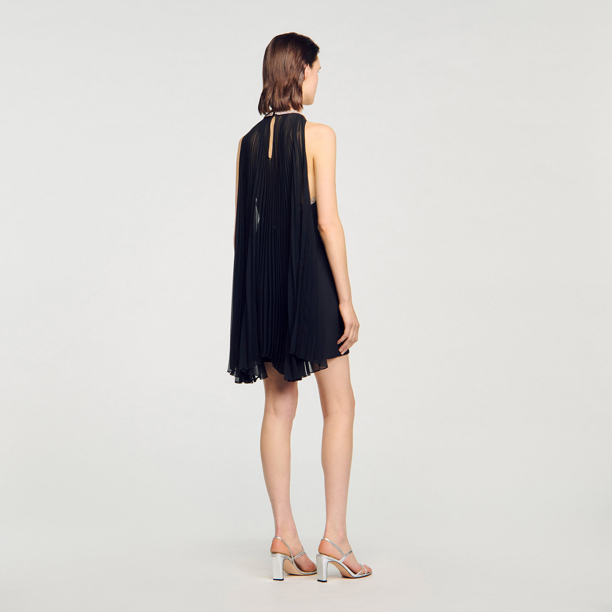 Korte jurk met cape en stras