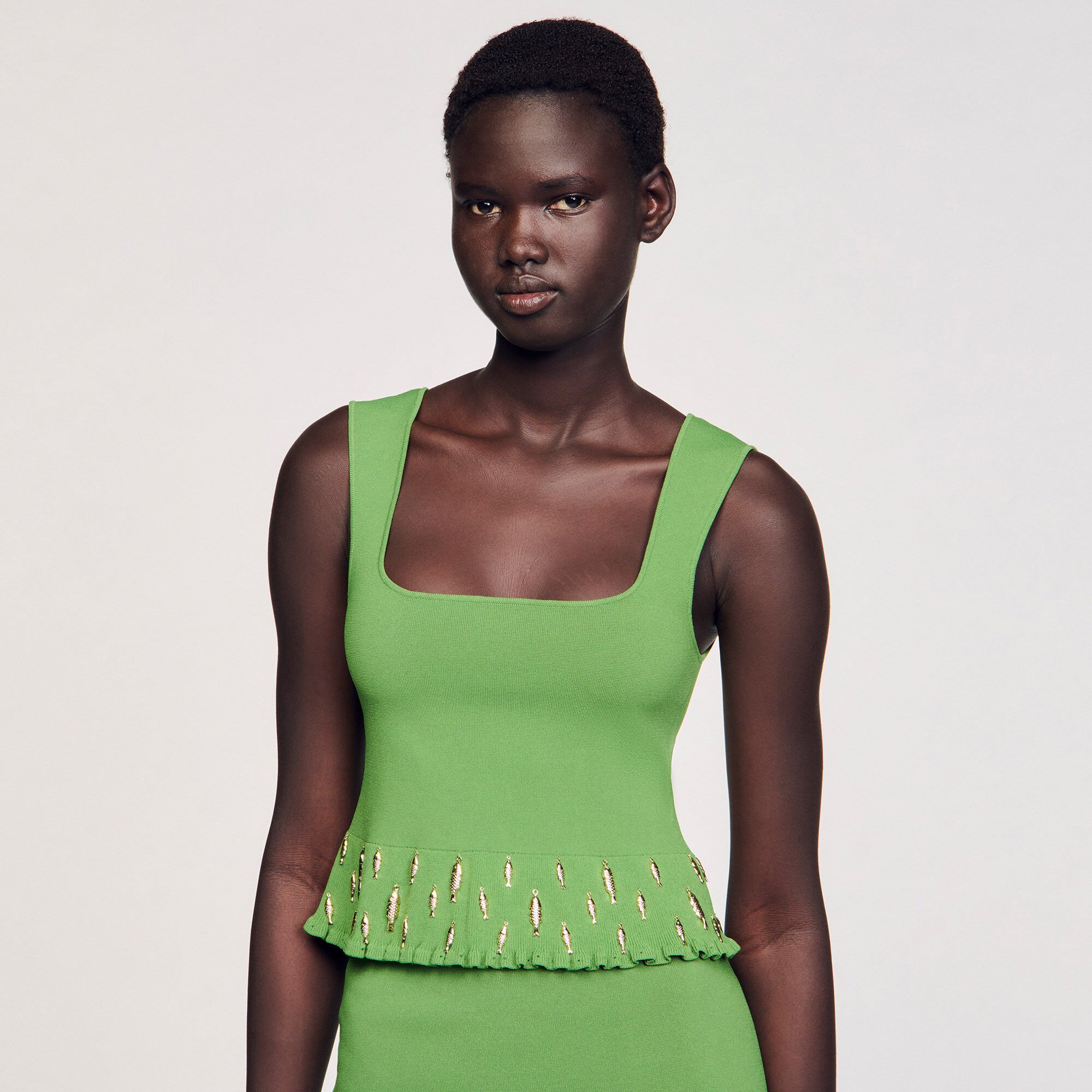 Top tricot met kwastjes