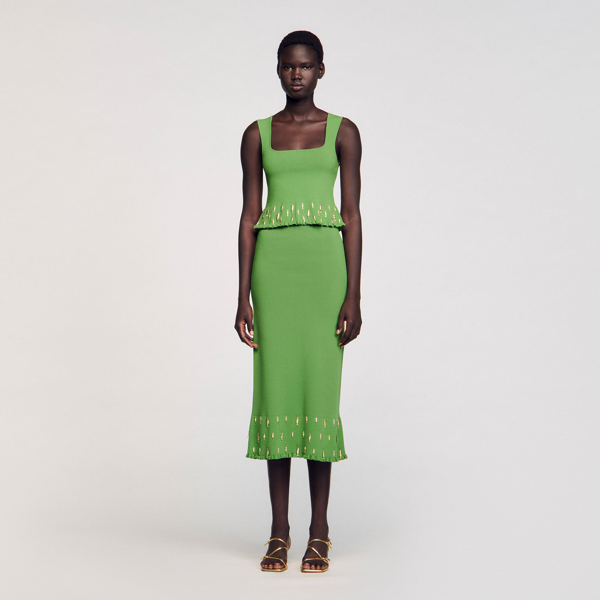 Top tricot met kwastjes