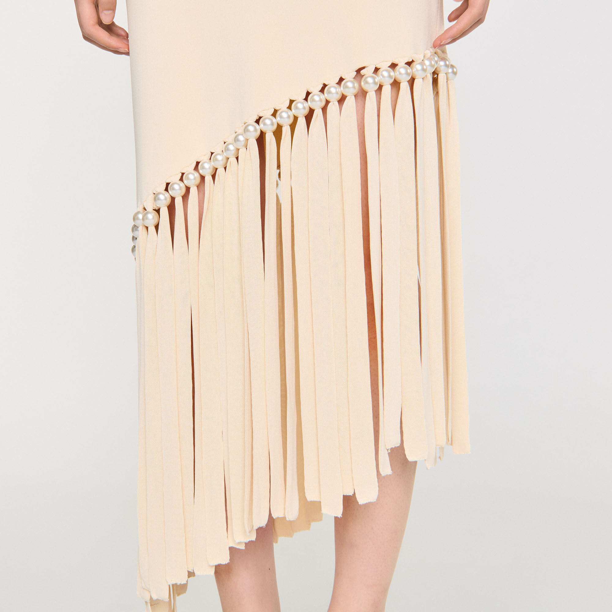 Jurk tricot met franjes en parels