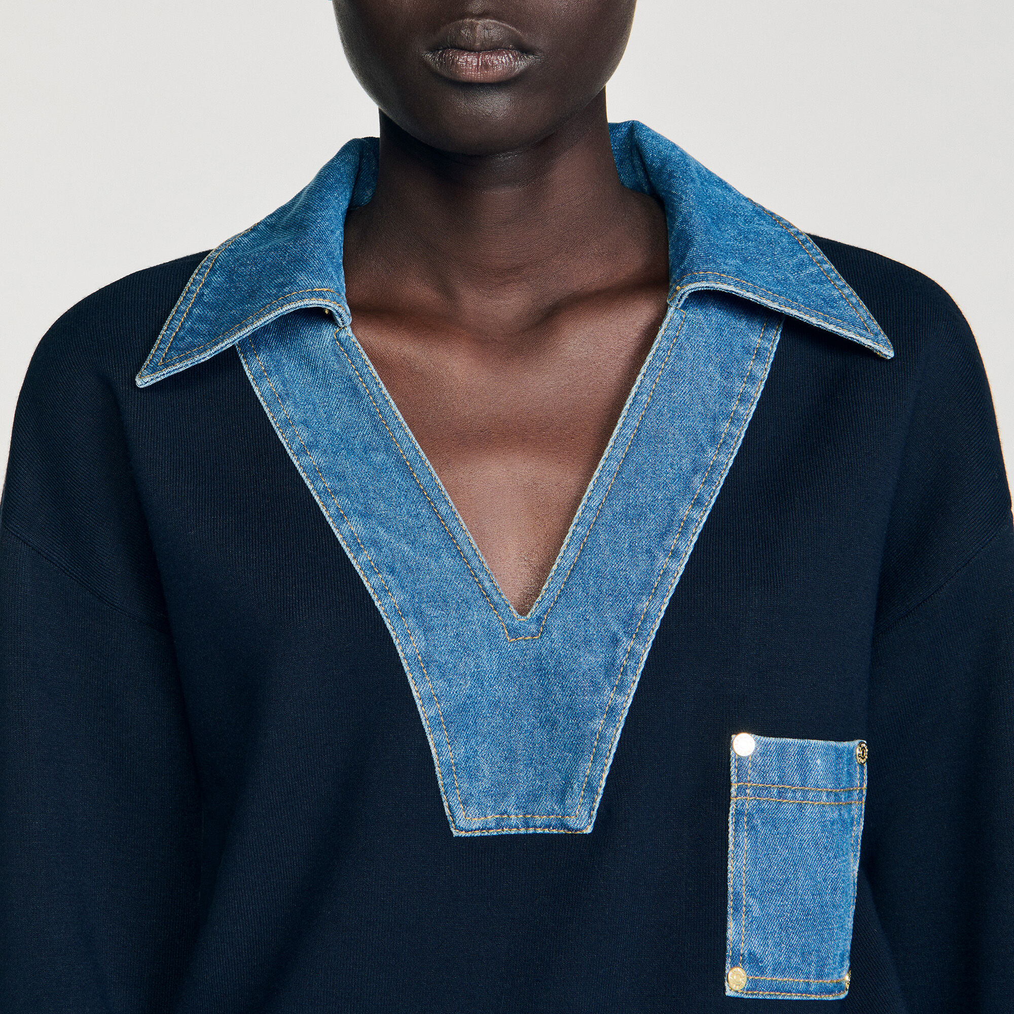 Trui met denimdetails