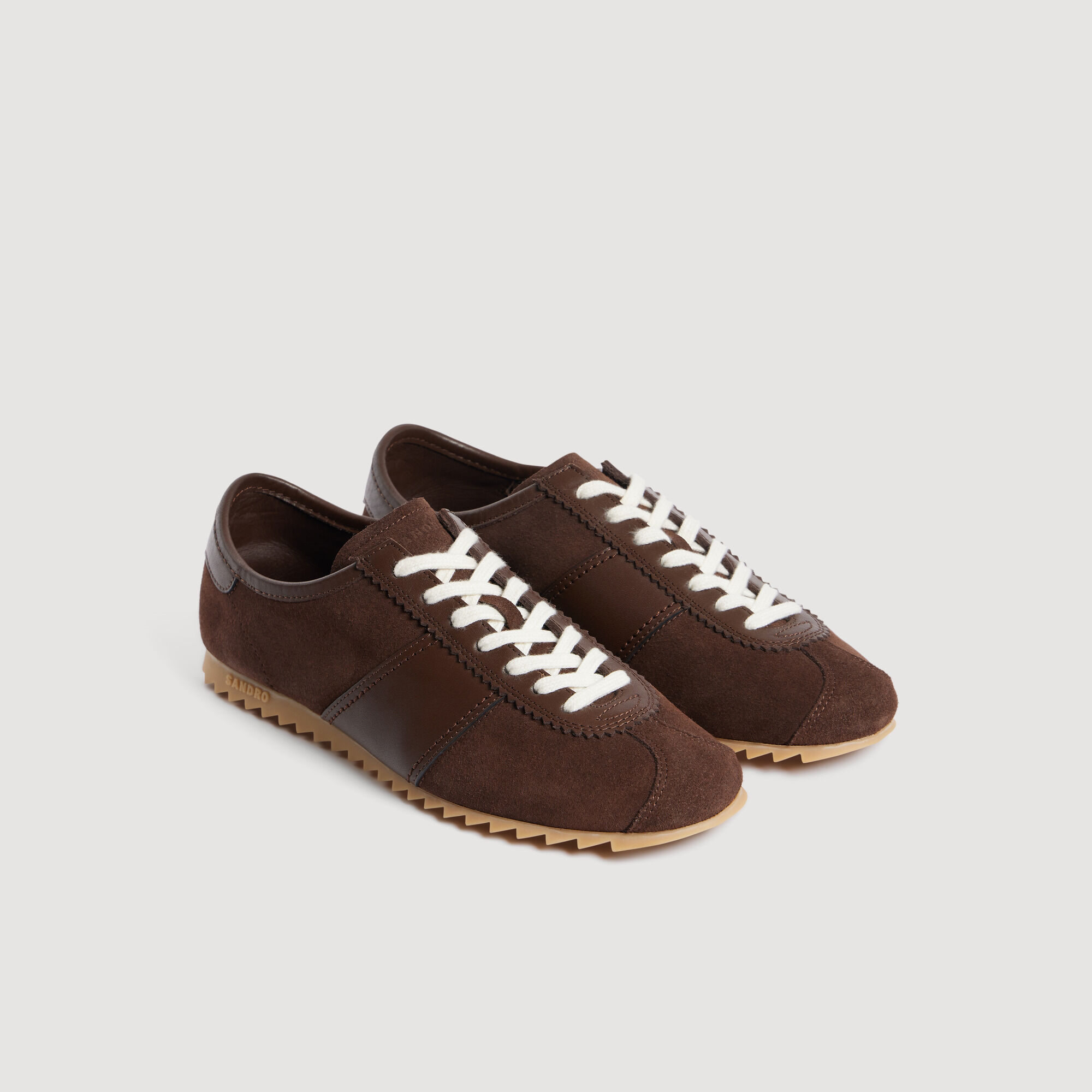 Lage sneakers van leer en su&egrave;de