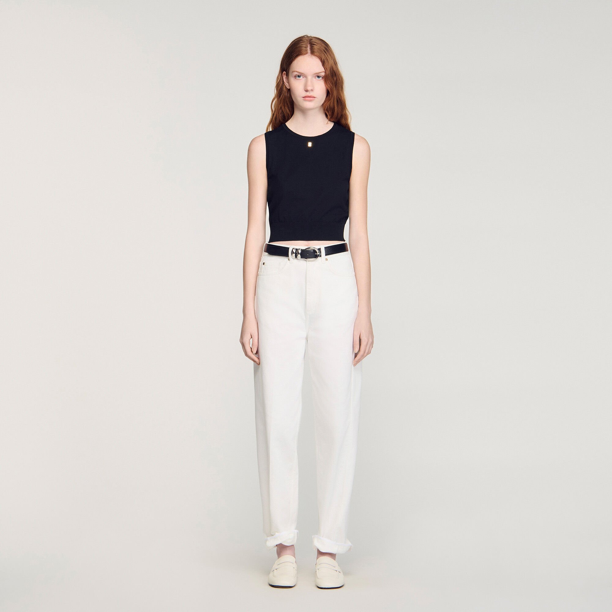 Korte gebreide mouwloze trui