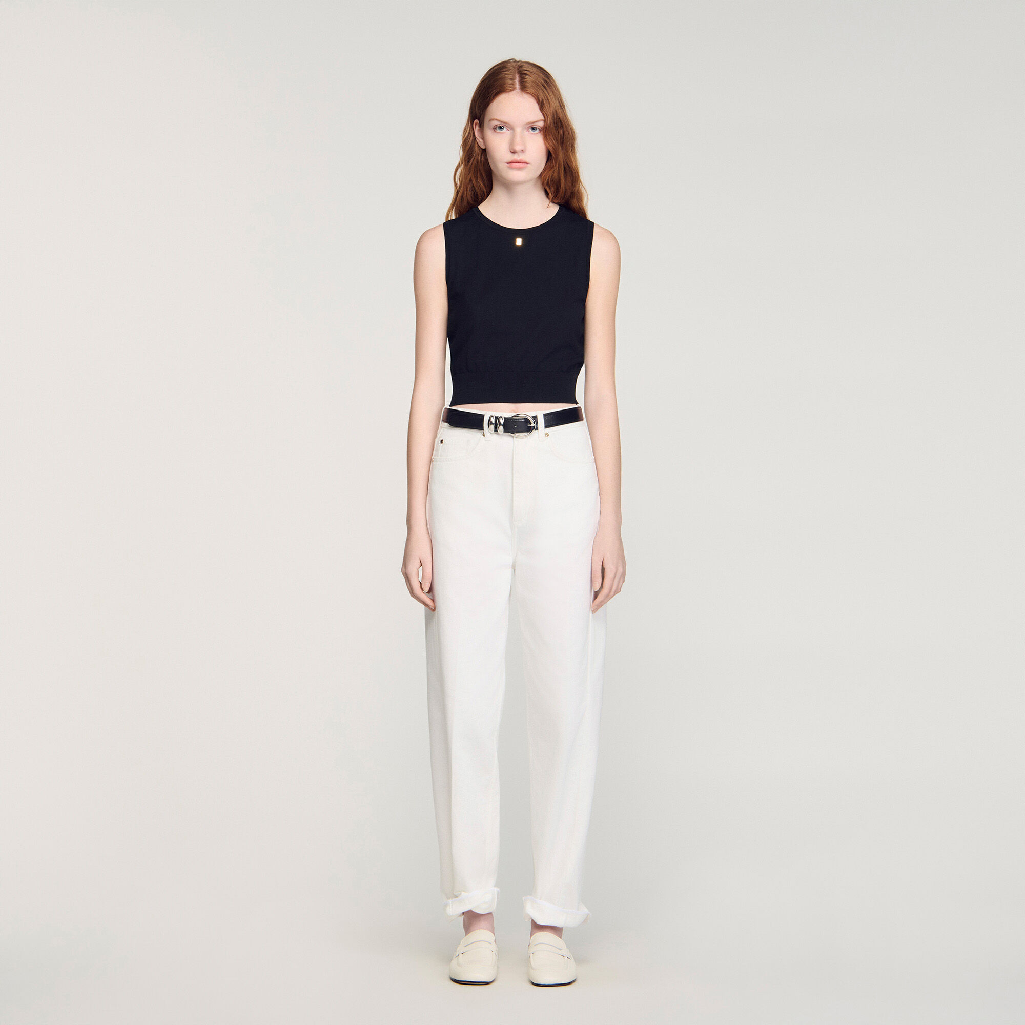 Korte gebreide mouwloze trui