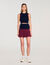 Korte geplooide bicolor rok