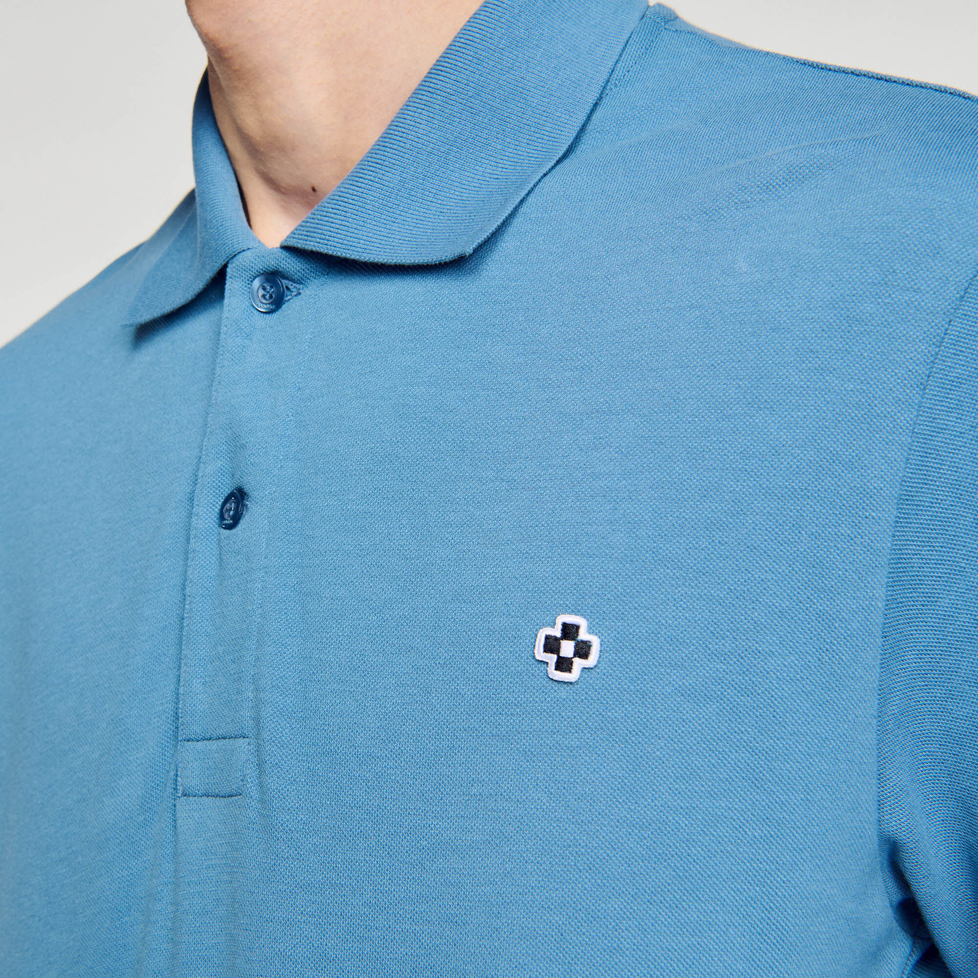 Polo met square cross-patch