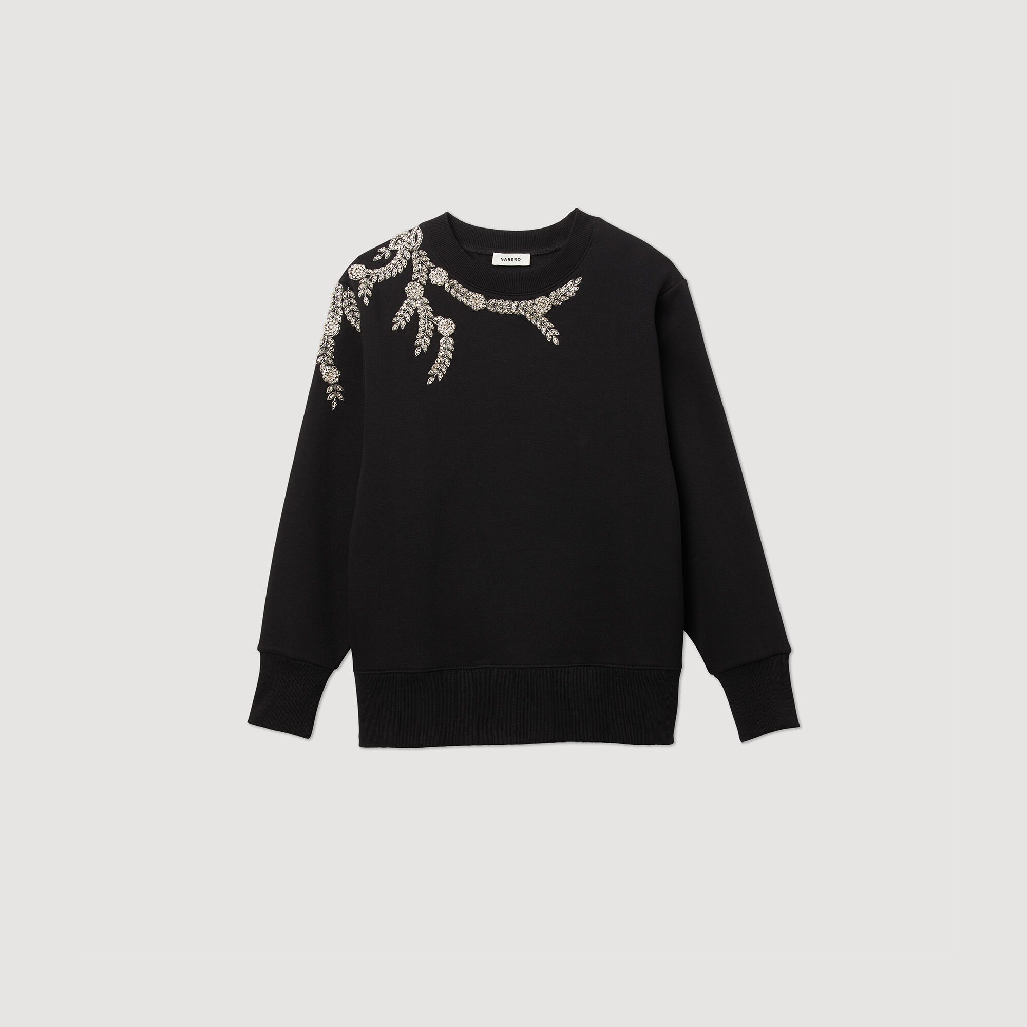 Sweater met sieraad